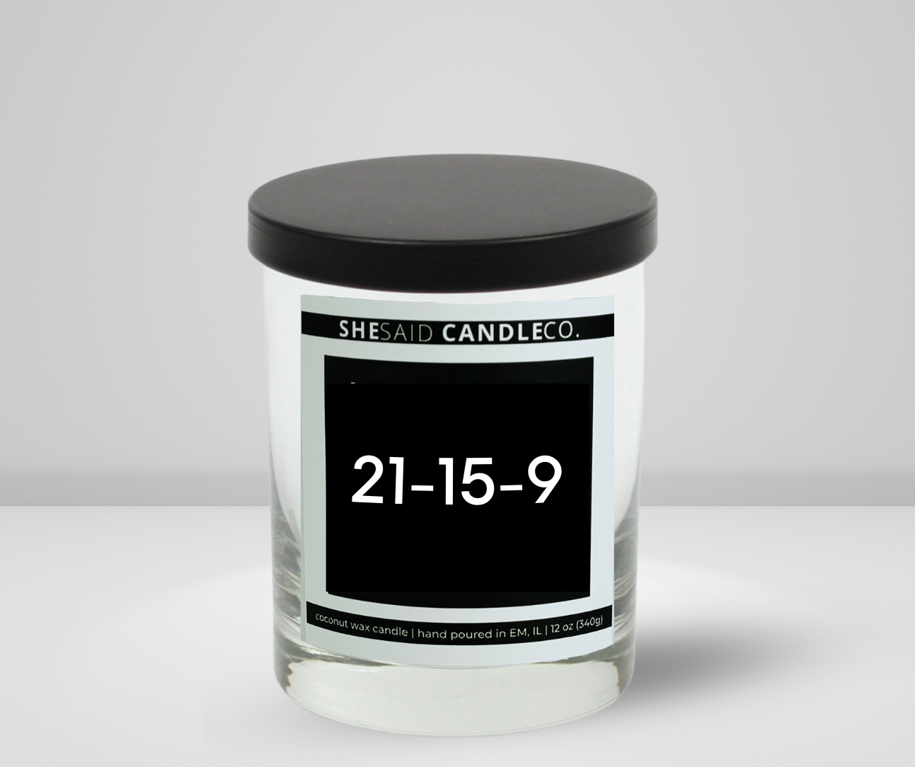 10oz clear jar candle made by She Said Candle co labeled 21-15-9