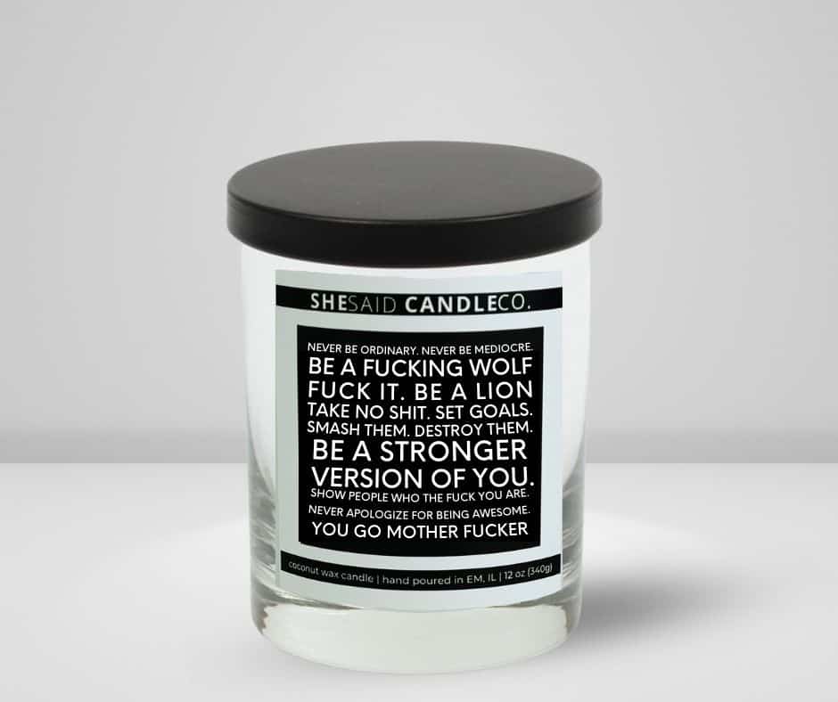 10oz clear jar candle made by She Said Candle Co labeled Never Be Ordinary