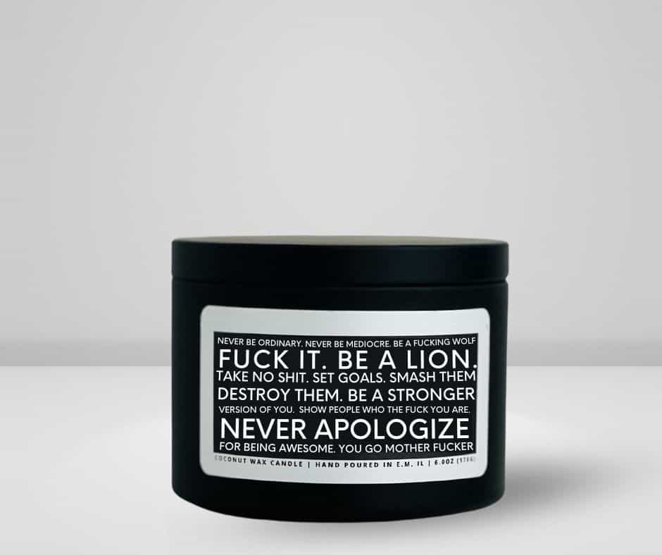 6oz matte black tin made by She Said Candle Co labeled Never Be Ordinary