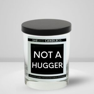 12oz matter white jar candle made by She Said Candle Co labeled Not A Hugger