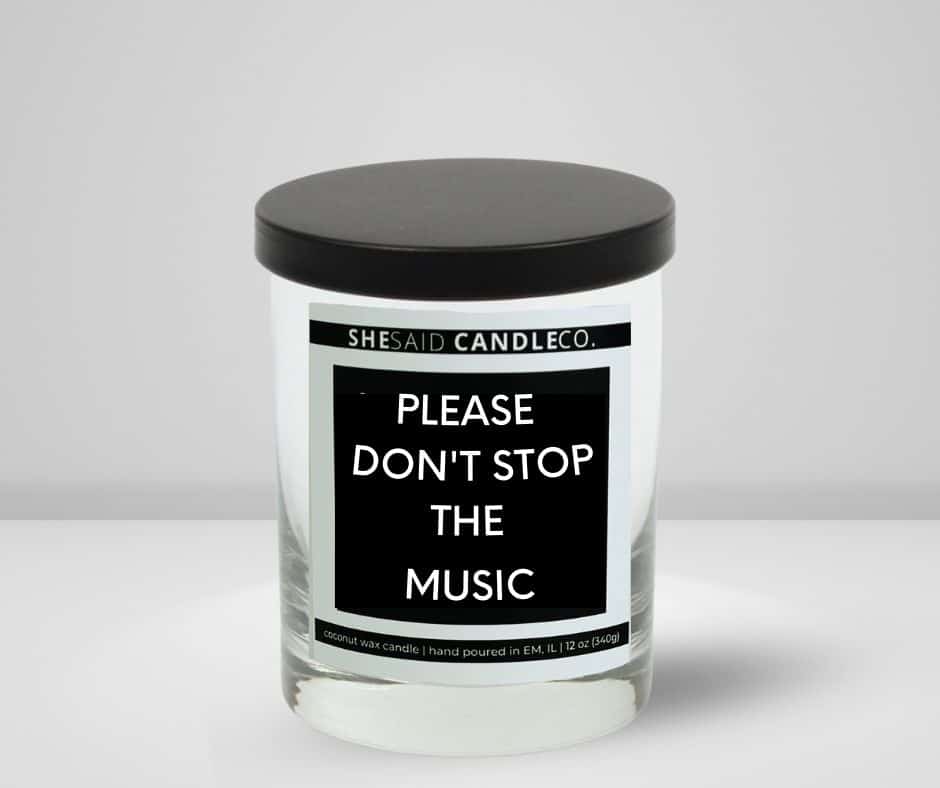 10oz clear jar candle made by She Said Candle Co labeled Please Don't Stop The Music