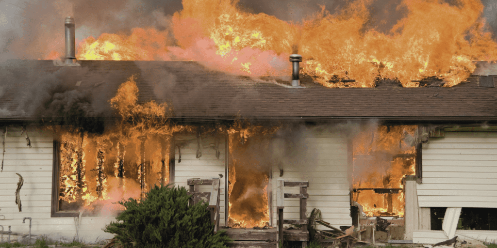 house in flames caused by a candle fire